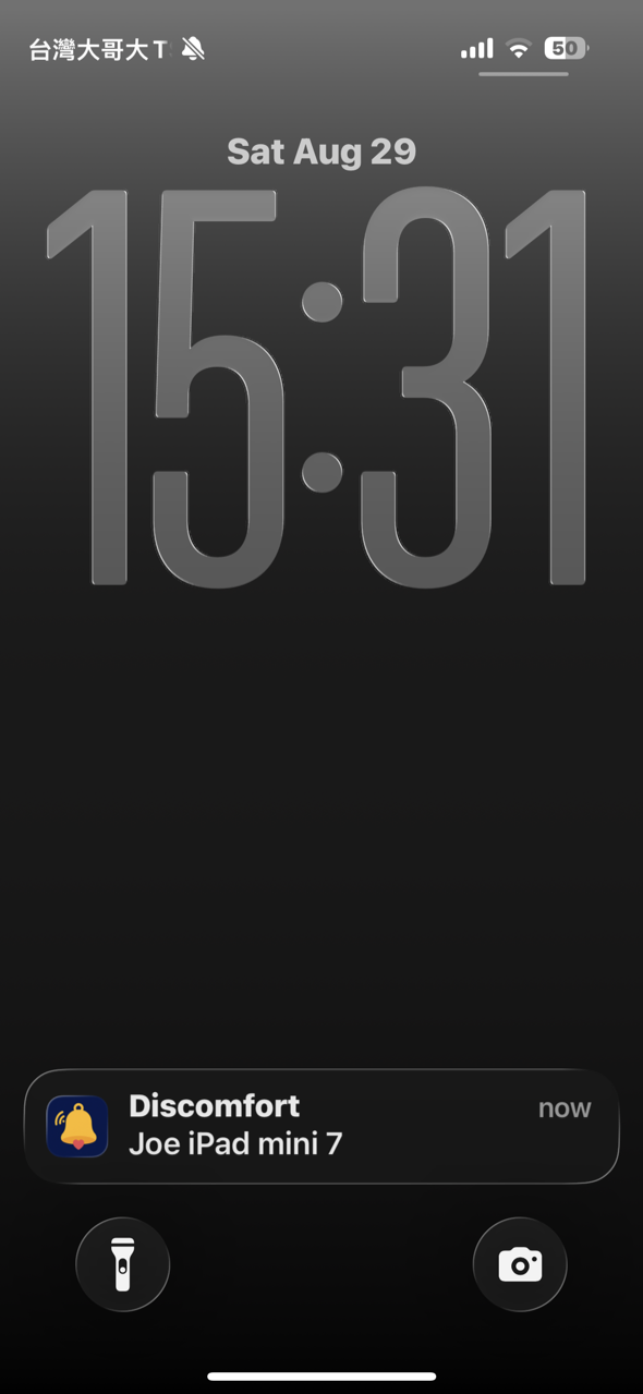 A Discomfort notification on the iPhone lock screen, sent from the patient iPad, with a silent-mode icon in the status bar