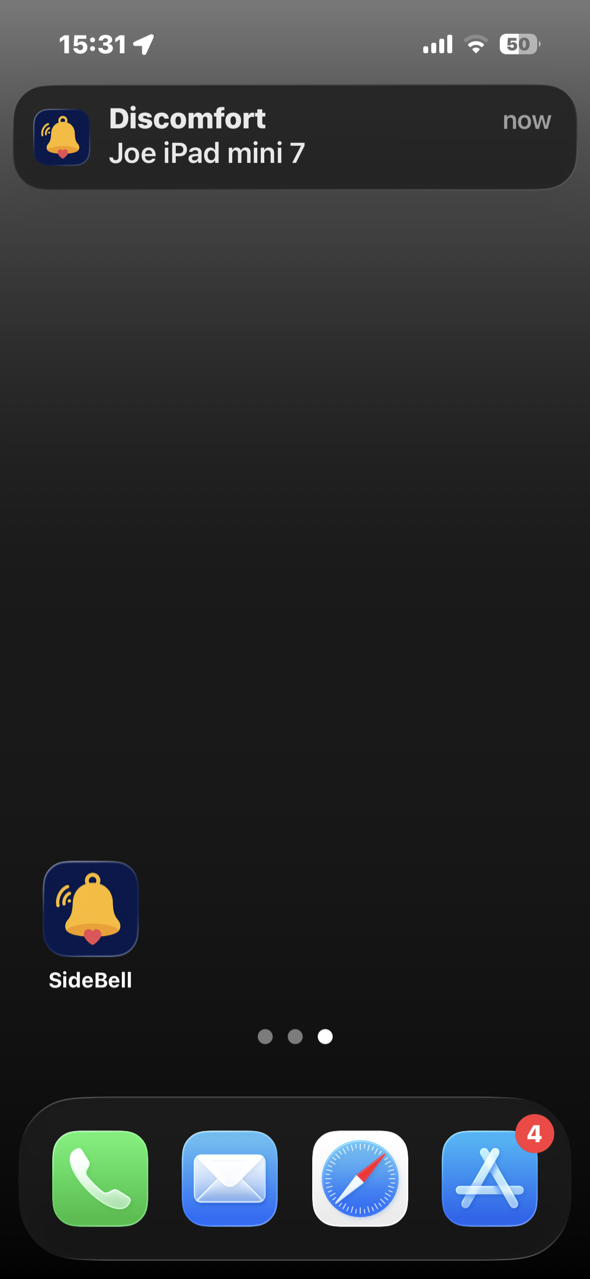 A Discomfort notification banner at the top of the iPhone home screen